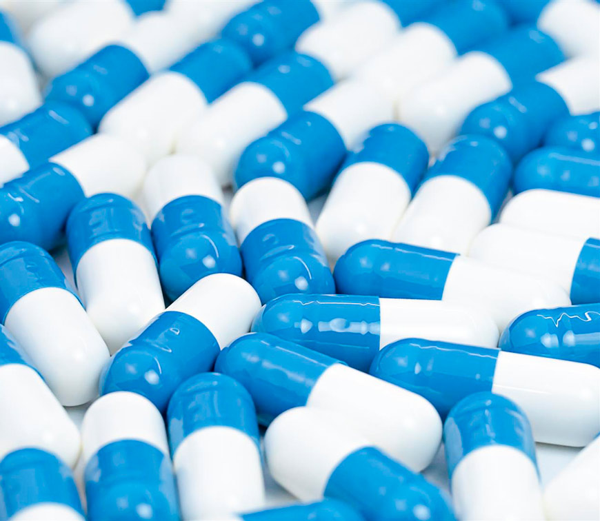 background-medical-white-blue-pills-capsules-(Large)